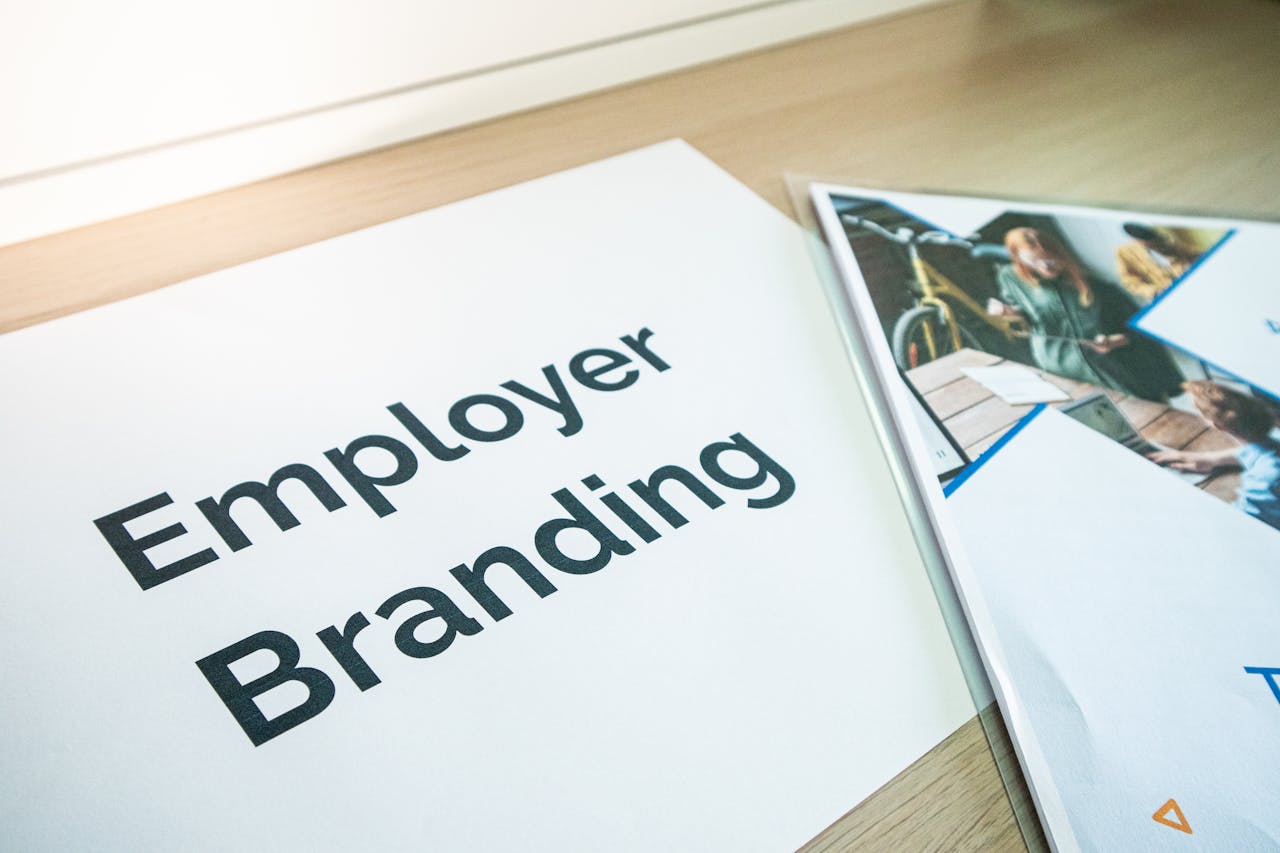 hero-img Focus on employer branding with documents on a wooden desk, ideal for business concepts.